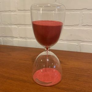 Sand timer 10 minute clear glass with red sand.